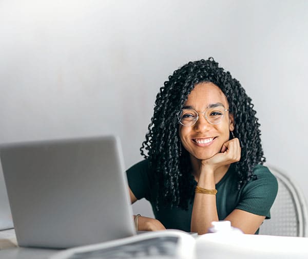 Woman Smiling at Online Learning